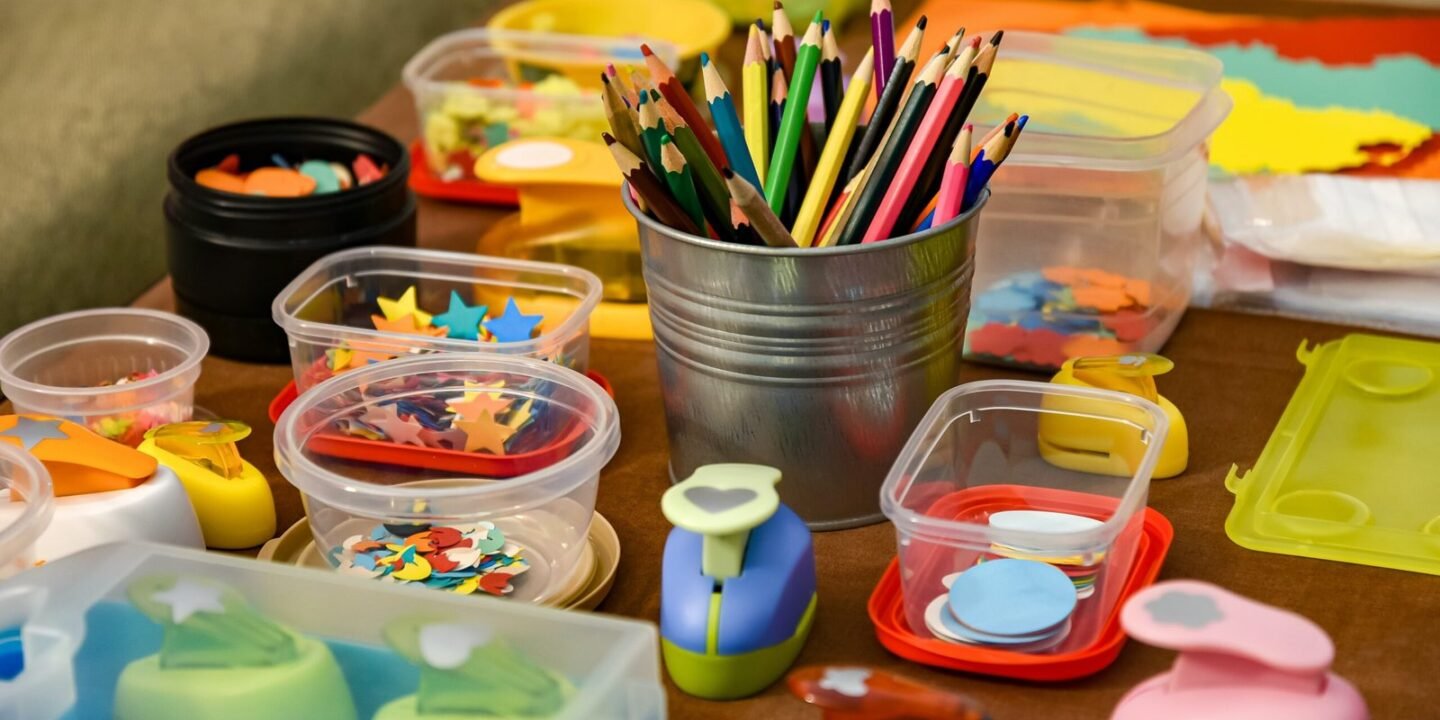 assorted color pencils in clear plastic container