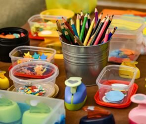 assorted color pencils in clear plastic container